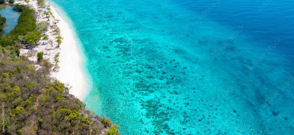 Banner of the summer tropical island beach with seashore as the tropical island in a coral reef ,blue and turquoise sea Amazing nature landscape with blue lagoon