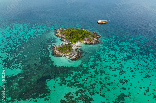 Fototapeta Naklejka Na Ścianę i Meble -  The aerial view the Tropical island beach with seashore as the tropical island in a coral reef ,blue and turquoise sea Amazing nature landscape with blue lagoon