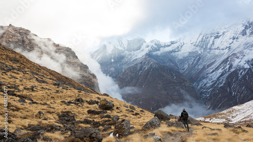  Hikers walk the track ABC to Machhapuchhre Base Camp, Annapurna Conservation Area, Himalaya, Nepal photo