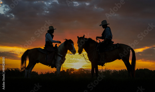 cowboy man american west with horse in rice field time shadow sunlight. © Tanison