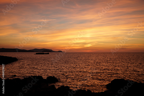 Cala Viola de Ponent  Menorca. September 2021. Magnificent sunset in the Mediterranean Sea. On one of the paradisaical beaches of the island of Menorca.