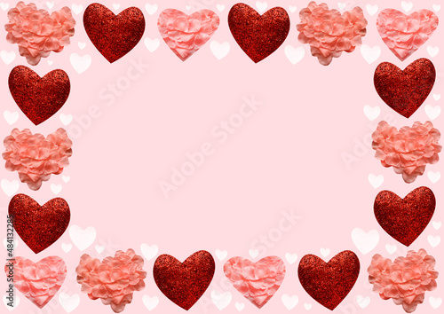 Festive card for Valentine's Day. Red and pink hearts on a pink background. copy space. Frame from hearts.
