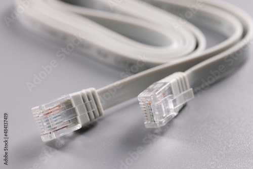 Closeup of rj45 cable on gray background photo