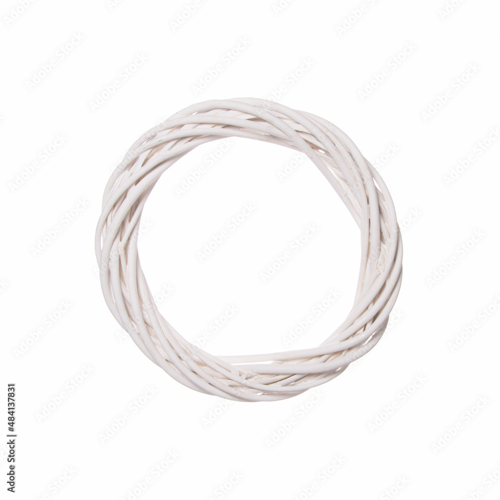 Hoop of knitted white wicker on a white background. Minimal creative concept of a decorative circle of wood. Hoop of knitted white wicker on a white background. Minimal creative concept of a decorative circle of wood.