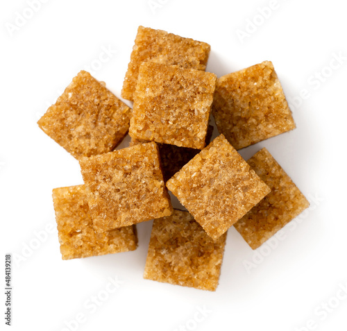 Brown sugar cubes isolated on white background, top view