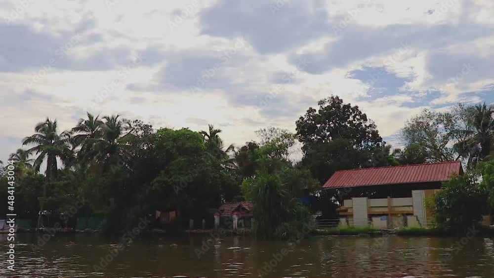 remote village at the edge of sea backwater with palm tree at morning from flat angle remote village at the edge of sea backwater with palm tree at morning from flat angle