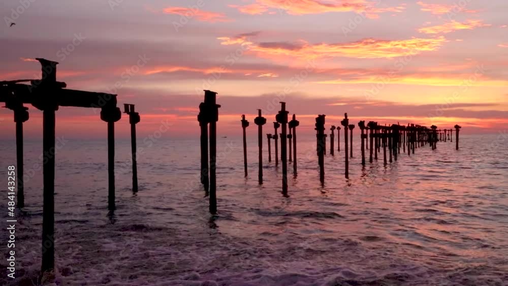 sunset colorful dramatic sky with iron pool leading line to the sea horizon at evening sunset colorful dramatic sky with iron pool leading line to the sea horizon at evening