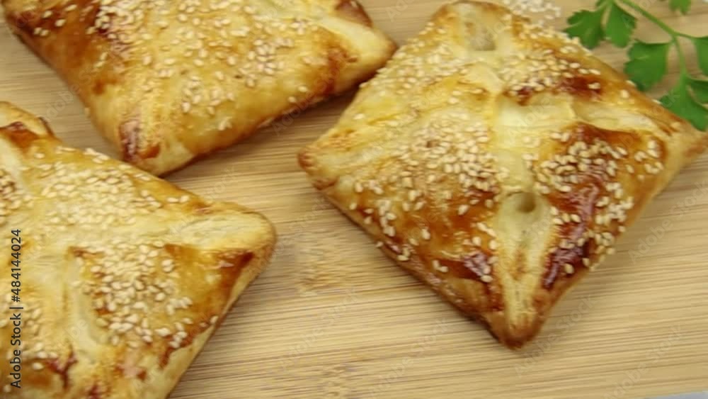 flaky with sesame seeds on a wooden board flaky with sesame seeds on a wooden board