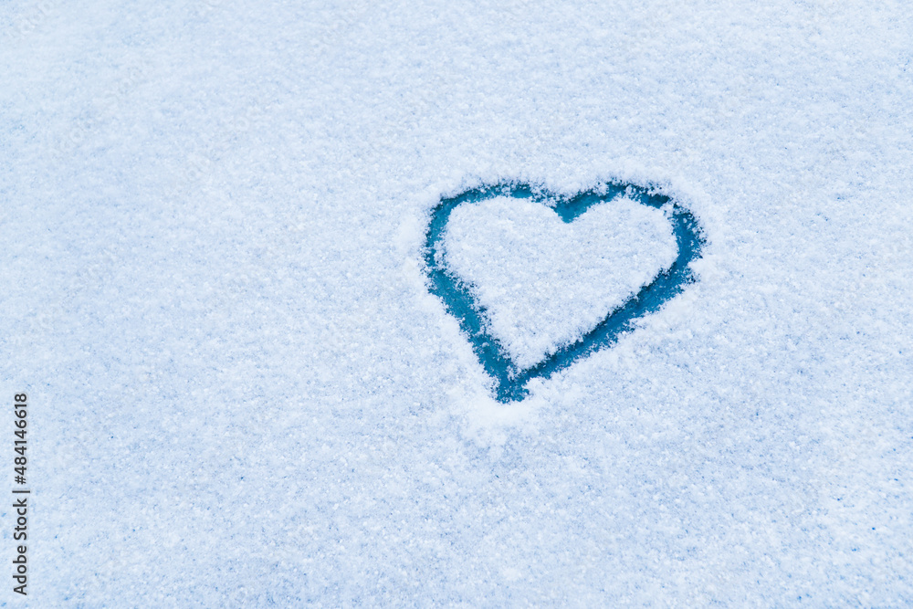 Heart in the snow. Drawing of the heart in winter Heart in the snow. Drawing of the heart in winter