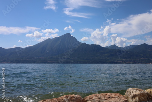 Torri del Benaco, Italy, Lake Garda, August 2021 View of the lake and the mountain formation from the east side to the west side of the lake in beautiful weather with blue sky