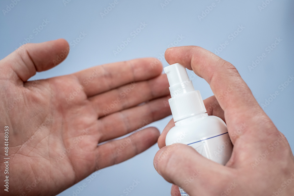 Hand of lady that applying alcohol spray or anti bacteria spray to prevent spread of germs, bacteria and virus. Personal hygiene concept Hand of lady that applying alcohol spray or anti bacteria spray to prevent spread of germs, bacteria and virus. Personal hygiene concept