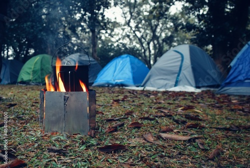 Outdoors cooking, cooking on camping , cooking in front of tent, making tea in the forest camping and tenting.