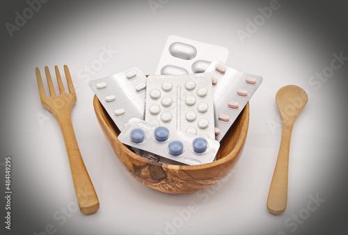Foto allegorical photo about self-consumption of medicines as if they were food