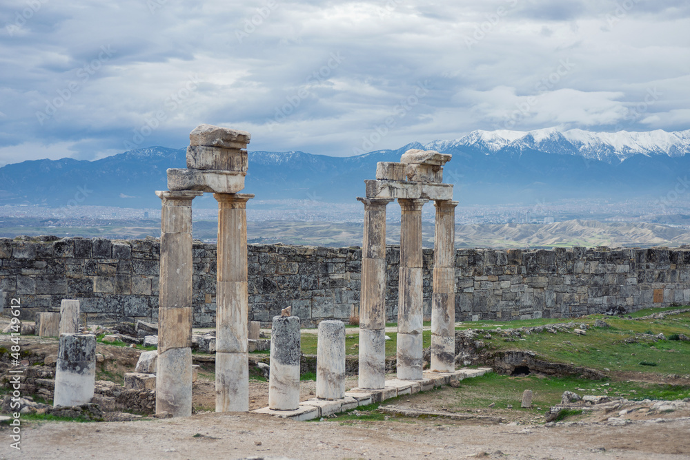 Snowy mountains view with ancient ruins from Pamukkale, Denizli, Turkey