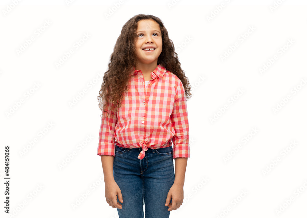 childhood and people concept - smiling little girl in casual clothes looking up over white background childhood and people concept - smiling little girl in casual clothes looking up over white background