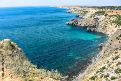 Cape Fiolent in Balaklava, Russia. View from the top of the cliff. azure sea, sunny day against a clear sky.