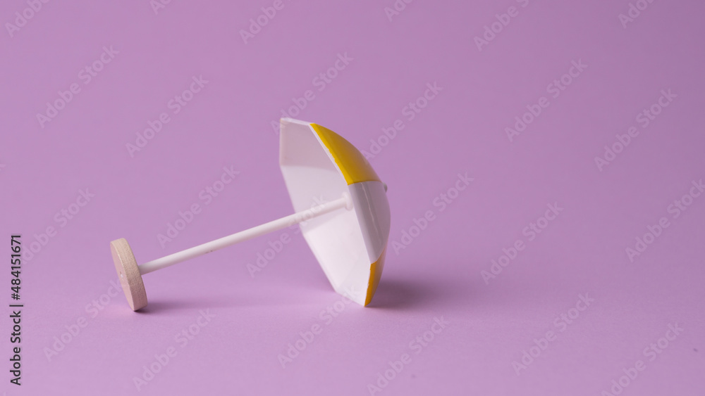 miniature colorful beach umbrella, isolated miniature colorful beach umbrella, isolated