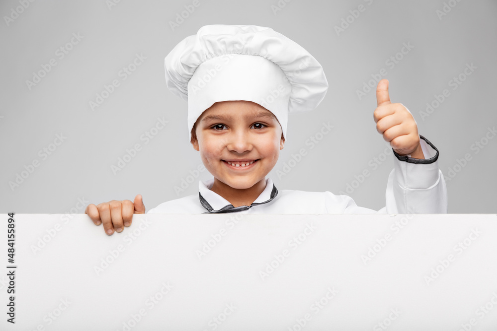 cooking, culinary and profession concept - happy smiling little girl in chef's toque and jacket with white board showing thumbs up gesture over grey background cooking, culinary and profession concept - happy smiling little girl in chef's toque and jacket with white board showing thumbs up gesture over grey background