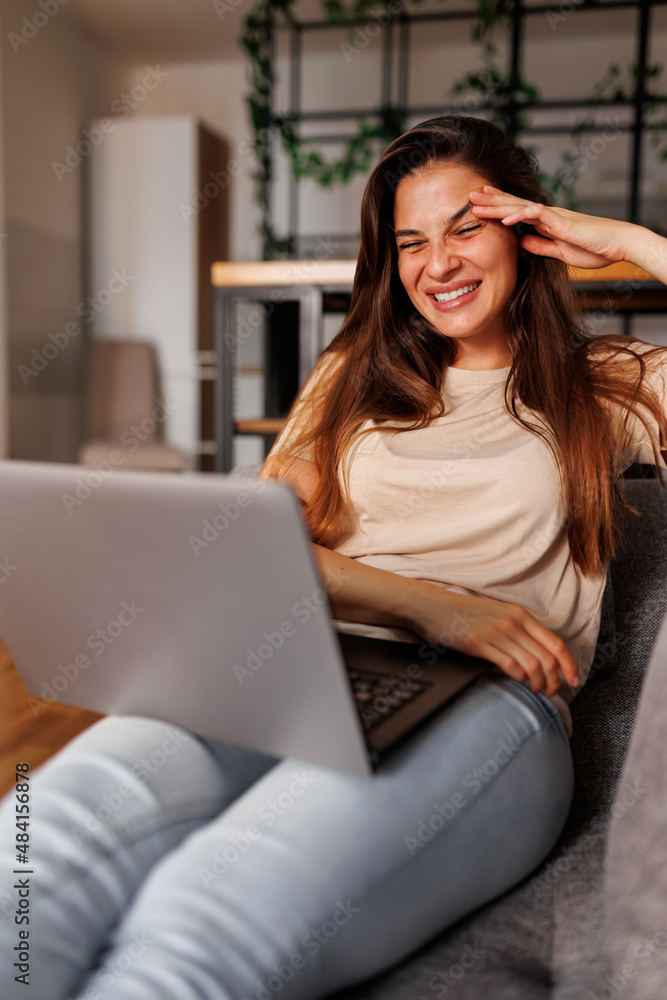 Woman having video call using laptop computer Woman having video call using laptop computer