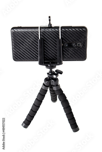 Black tripod for with installed smartphone. Isolation on white.