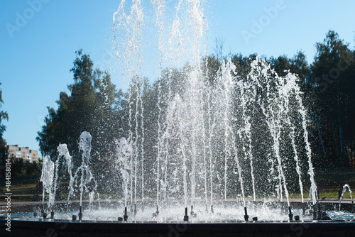 Fountain in park on sunny hot summer day  outdoors