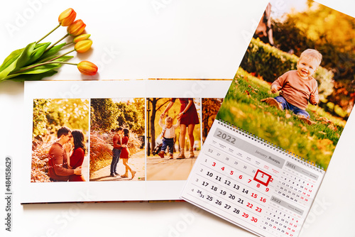calendar for 2022 with a photo of boy and photobook from a family photo shoot. 