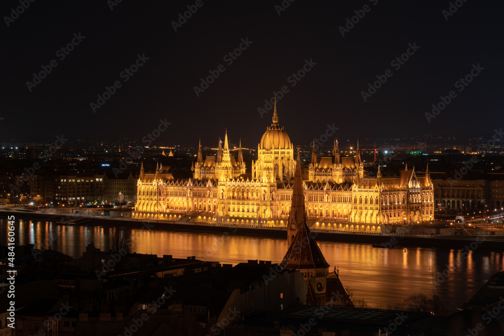 Hungarian parliament building from across the Danube river at night Budapest Hungary Europe