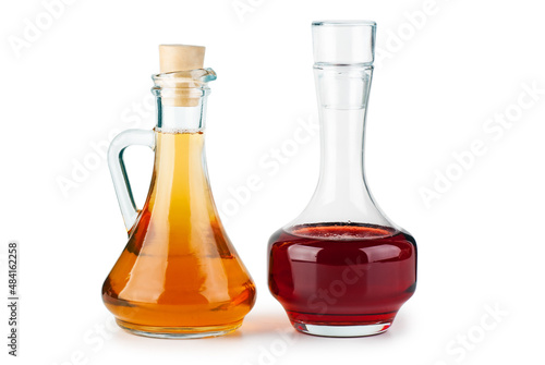 Two small decanters with apple and red wine vinegar