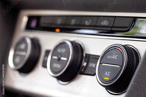 Modern car climate controls, macro. Modern climate control regulators in the car. Beautiful interior, comfort © HENADZY
