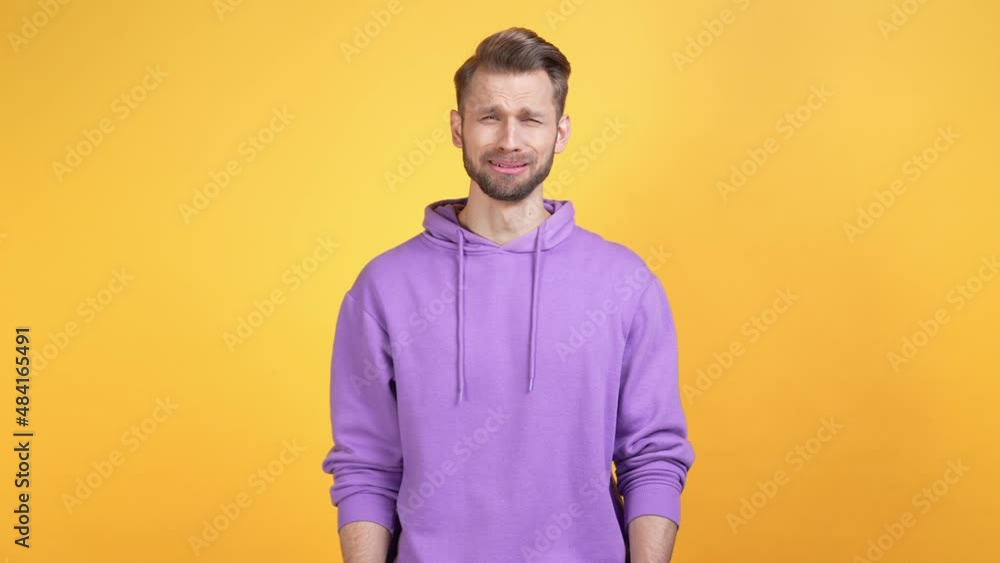 Frustrated guy mourn cry rub eyes isolated bright color background Frustrated guy mourn cry rub eyes isolated bright color background