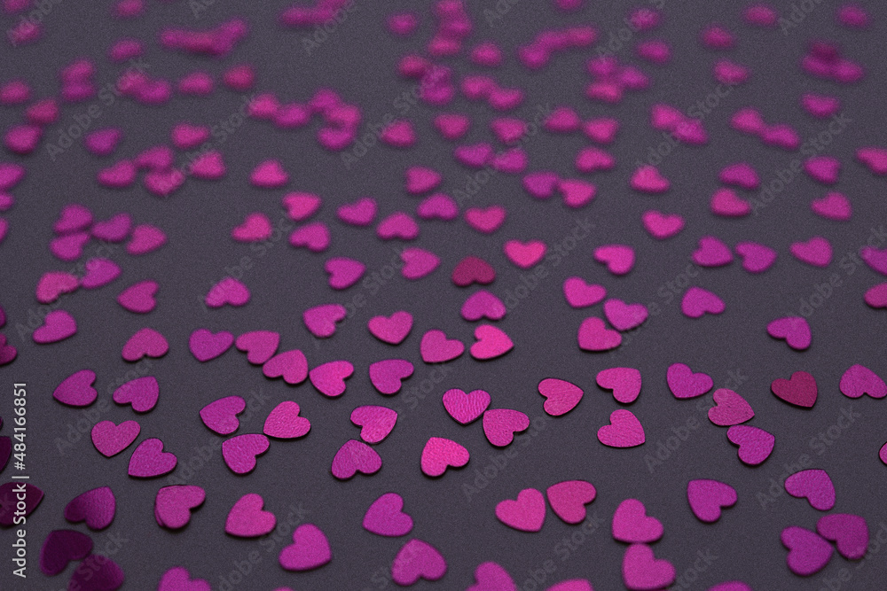 Beautiful heart confetti falling on the Very Peri background. Invitation Template Background design, greeting cards, poster. Valentine's Day.