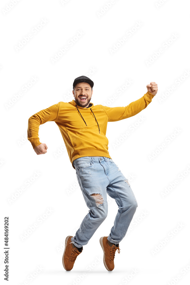 Full length portrait of a cheerful young casual man dancing