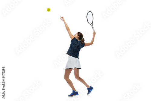 Dynamic portrait of young sportive woman, tennis player practicing isolated on white background. Healthy lifestyle, fitness, sport, exercise concept. © master1305