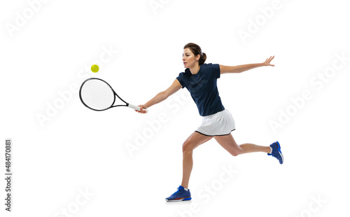 Portrait of young sportive woman, tennis player playing tennis isolated on white background. Healthy lifestyle, fitness, sport, exercise concept.