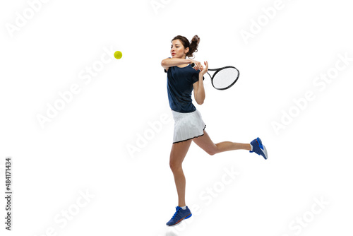 Portrait of young sportive woman, tennis player playing tennis isolated on white background. Healthy lifestyle, fitness, sport, exercise concept. © master1305