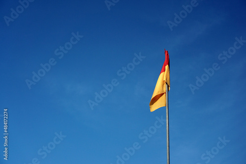 A red over yellow flag at beach signifies a recommended swimming area that has lifeguard supervision. 