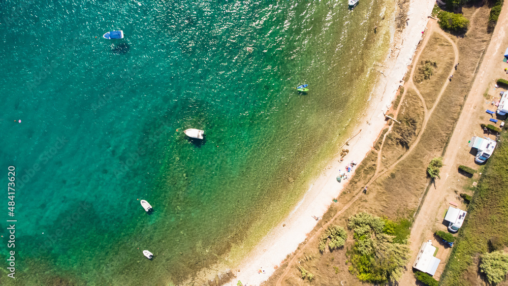 Aerial drone view of ocean sea coast at summertime tourist seaso