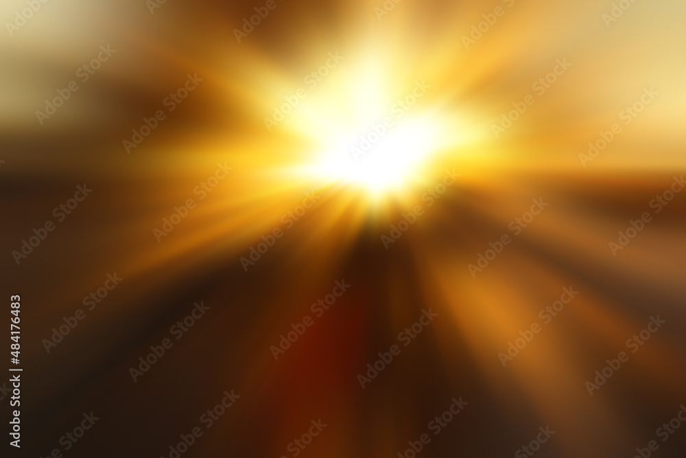 Abstract blurred golden background with a  flash and diverging rays in the middle