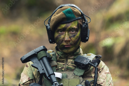 British armed forces lady soldier guarding pose . High quality photo photo