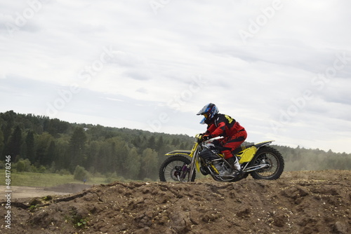 Fototapeta Naklejka Na Ścianę i Meble -  motocross bikers on motorcycles with carrycot