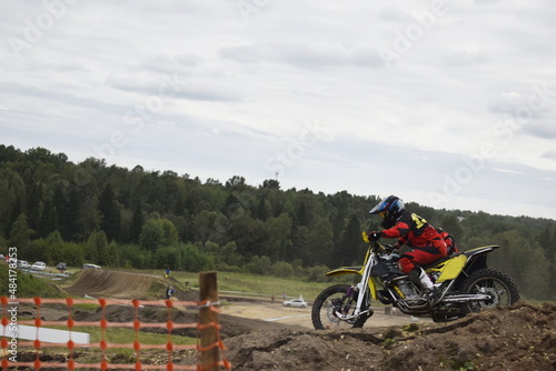 motocross bikers on motorcycles with carrycot