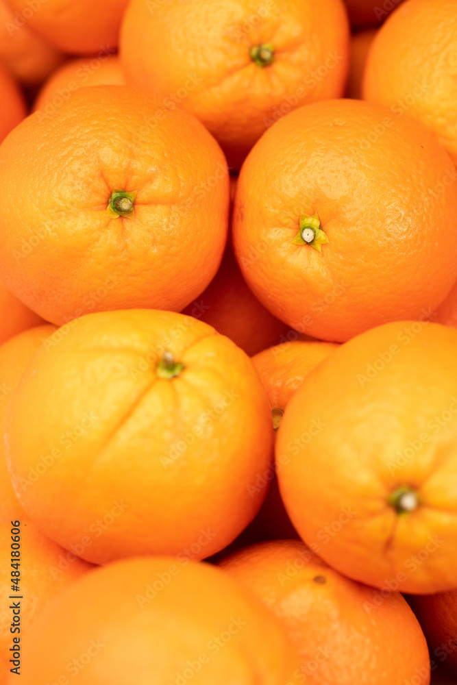 Orange fruit. Vertical view of few fresh juicy oranges. Close-up Orange fruit. Vertical view of few fresh juicy oranges. Close-up