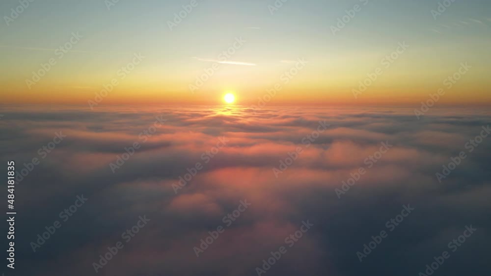 flying above the clouds during a beautiful sunset flying above the clouds during a beautiful sunset
