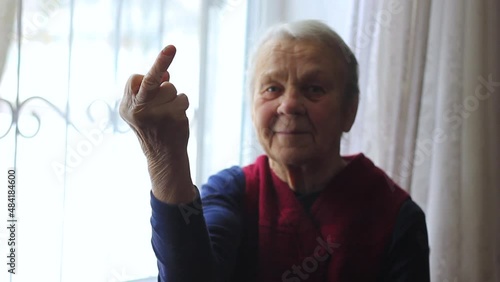 Grandma shows her middle finger.