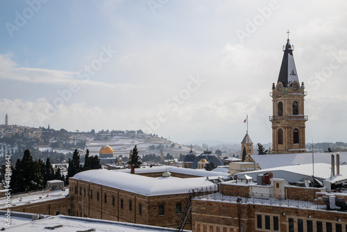 aerial view of jerusalem with snow and close up of the dome of the rock and church of holy sepulchre
