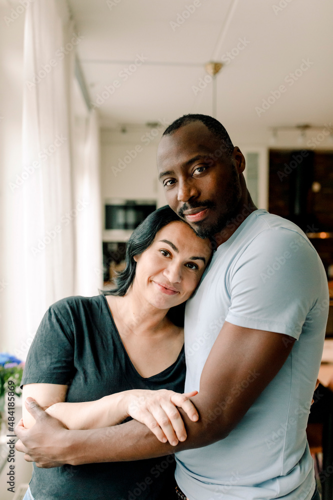 Portrait of smiling heterosexual couple at home Portrait of smiling heterosexual couple at home