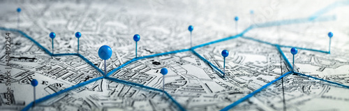 Routes with blue pins on a city map. Concept on the  adventure, discovery, navigation, communication, logistics, geography, transport and travel topics.