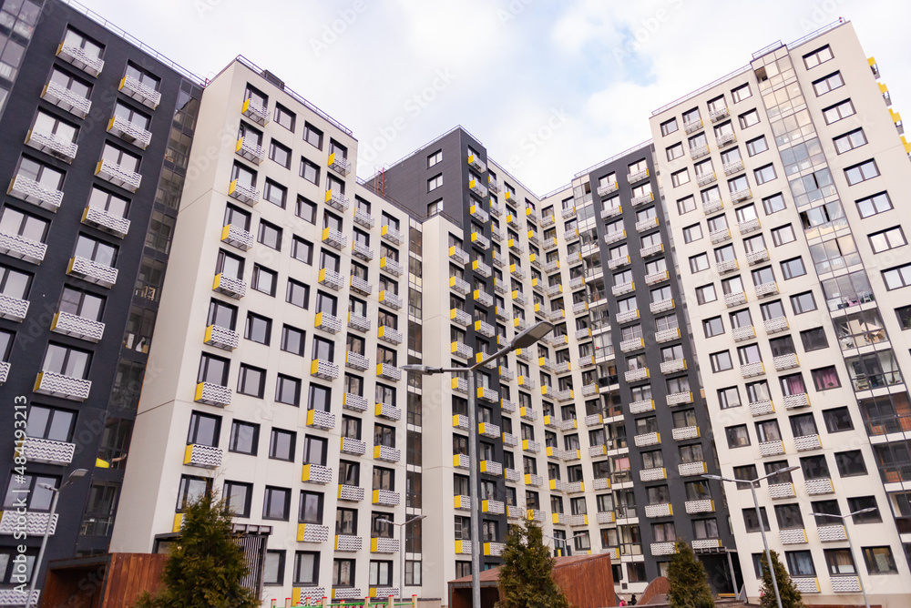 Facades of a new residential building. New multi-storey building in the housing complex of New Moscow.