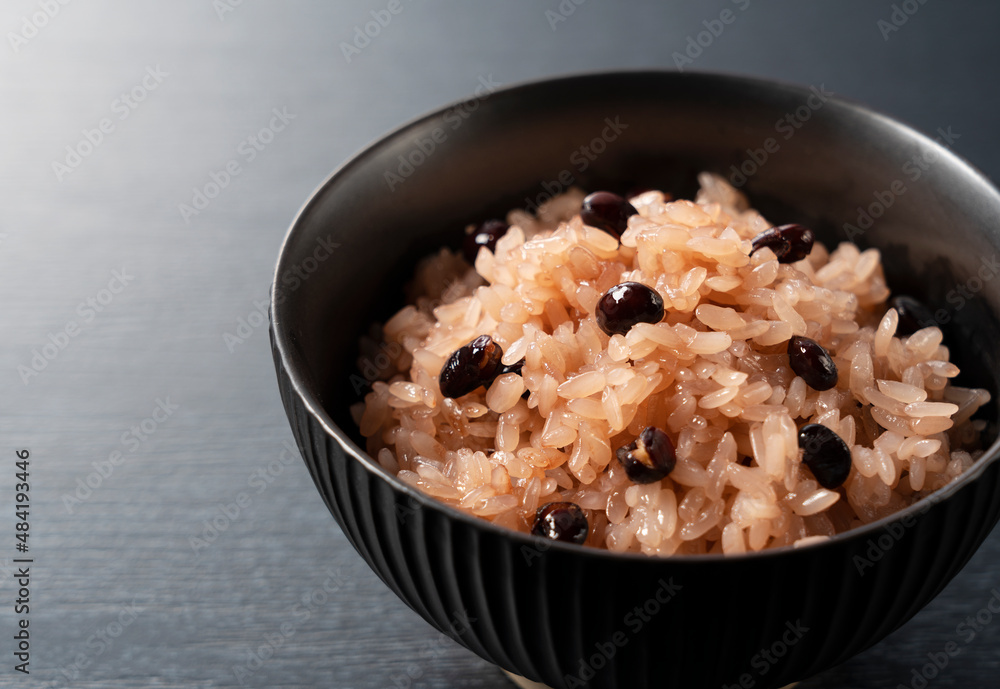 Red rice placed on a black background. Red rice placed on a black background.