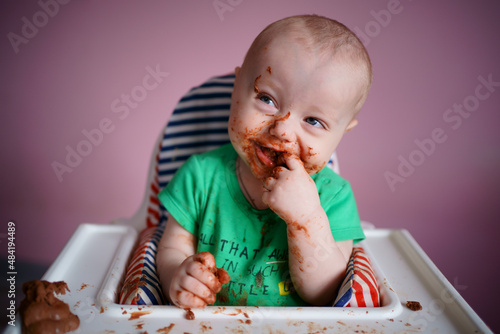 baby stained in chocolate. High quality photo